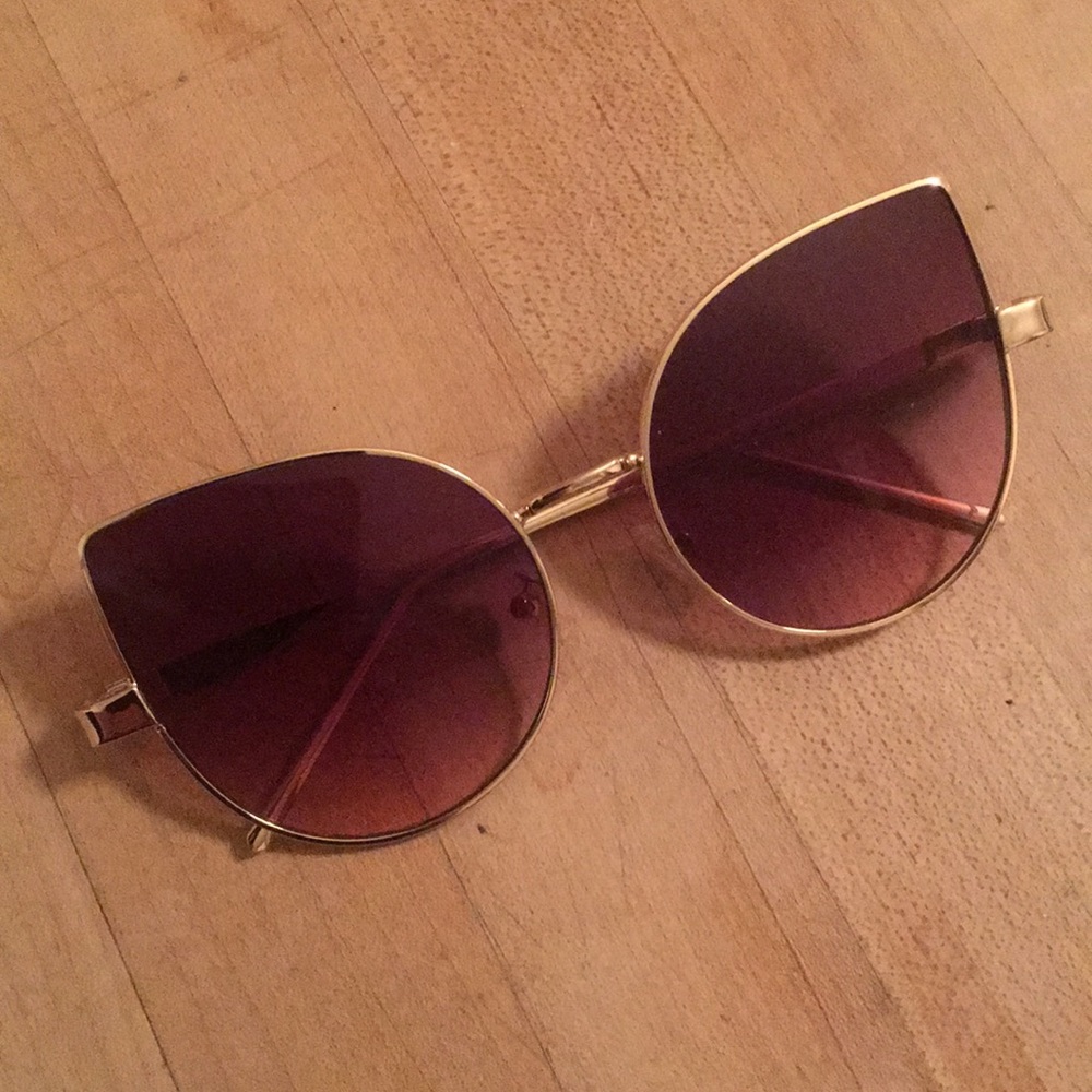 Cat eye sunglasses with purple tinted lenses